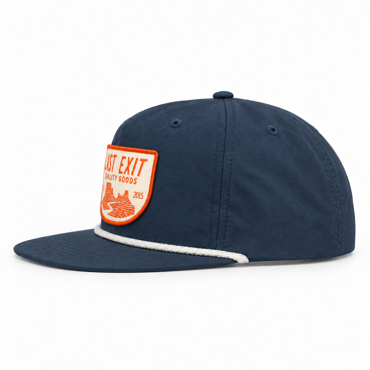A navy blue flat-brim cap with a white rope detail along the edge of the brim and an orange and white 'Last Exit Quality Goods' patch on the front, shown against a plain white background.